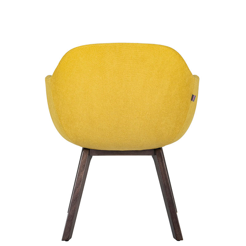 Sillón de Visita Kimbra amarillo detrás con base de madera de haya disponible en colores Wenge, Negro y Natural.